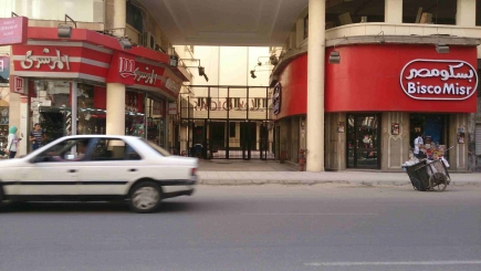 <a class="fancybox" rel="gallery-" href="https://www.passageways.clustermappinginitiative.org/sites/default/files/styles/largest/public/d18_001.jpg?itok=2IaukWva" title="Entrance of Cinema Radio Passage from Talaat Harb Street">Enlarge</a><br >2015, Aug 09<br>Entrance of Cinema Radio Passage from Talaat Harb Street